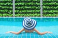 Young asian woman relaxing in swimming pool at spa resort. Relaxing concept. Women are relaxing at the poolside Royalty Free Stock Photo