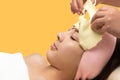 Young asian woman removing facial peel off mask Royalty Free Stock Photo