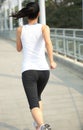 Young asian woman running at modern city footbridg Royalty Free Stock Photo