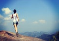 Young asian woman running on mountain peak Royalty Free Stock Photo