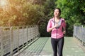 Young asian woman running on sidewalk in morning. Royalty Free Stock Photo