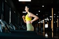Young Asian Woman Running on Treadmill Royalty Free Stock Photo