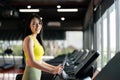 Young Asian Woman Running on Treadmill Royalty Free Stock Photo