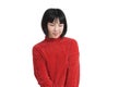 Young asian woman sad and pouting, wearing winter red sweater, isolated. Royalty Free Stock Photo