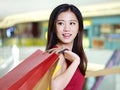 Young asian woman on a shopping spree Royalty Free Stock Photo