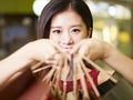 Young asian woman on a shopping spree Royalty Free Stock Photo