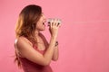 Young Asian woman shout with tin can phone Royalty Free Stock Photo