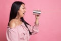 Young Asian woman shout with tin can phone Royalty Free Stock Photo