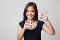 Young Asian woman show OK with a glass of drinking water. Royalty Free Stock Photo