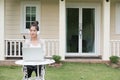 Young asian woman sitting on chair listening to music and using Royalty Free Stock Photo