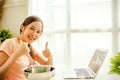 Young Asian woman sitting and learning how to make wonderful and delicious fresh milk ice cream.