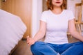 Young asian woman sitting practicing doing yoga meditation in bedroom,Workout exercise after waking up in morning,Healthy and life Royalty Free Stock Photo