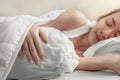 Young asian woman sleeping alone on white pillow on bed in bedroom on morning time Royalty Free Stock Photo