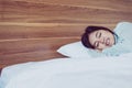 Young asian woman sleeping on bedroom and grinding teeth,Female tiredness and stress