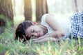 Young asian woman sleeping and lying down on grass Royalty Free Stock Photo