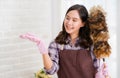 Asian woman cleaning home