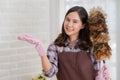 Asian woman cleaning home