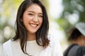 Young Asian woman smiling while looking at camera. Royalty Free Stock Photo