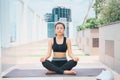 Young asian woman in sport wear doing sports outdoors