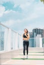 Young asian woman in sport wear doing sports outdoors Royalty Free Stock Photo