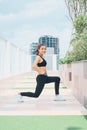 Young asian woman in sport wear doing sports outdoors Royalty Free Stock Photo