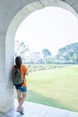 Young asian woman standing at the arched entrance of Kanchanaburi War Cemetery Don Rak Royalty Free Stock Photo