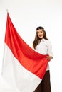 a young asian woman standing grab the indonesian flag