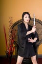 Young Asian Woman Standing with Sword