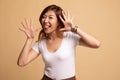 Young Asian woman sticking her  tongue out Royalty Free Stock Photo