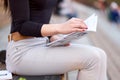 Young Asian woman student reading a lecture book. Preparation from the session and exams. outdoor city portrait Royalty Free Stock Photo