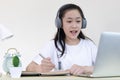 Young Asian woman is studying online and chatting with her teacher through the laptop, Online learning, stay home, New normal Royalty Free Stock Photo