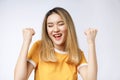 Young Asian woman with surprised excited happy screaming. Cheerful girl with funny joyful face expression Royalty Free Stock Photo