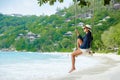 Young Asian women at a swing on a tropical beach in Mahe Tropical Seychelles Islands Royalty Free Stock Photo