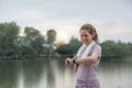 Young Asian woman takes care of her health by exercising. Stretch your legs in the park