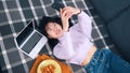 Young asian woman taking photo of her and her breakfast. Young influencer posting on social media Royalty Free Stock Photo