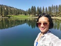 Selfie of young woman at Martin lake near Princeton, British Columbia, Canada Royalty Free Stock Photo