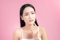 Young Asian woman touch and worry about her face. Acne, pimple, clear and clean, oily, dry skin concept Royalty Free Stock Photo