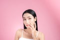 Young Asian woman touch and worry about her face. Acne, pimple, clear and clean, oily, dry skin concept