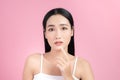 Young Asian woman touch and worry about her face. Acne, pimple, clear and clean, oily, dry skin concept Royalty Free Stock Photo