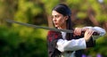 Young asian woman in traditional kimono trains in a fighting stance close-up portrait with katana sword samurai warrior girl in