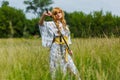 Young asian woman in traditional kimono trains fighting techniques with katana sword Royalty Free Stock Photo