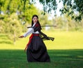 Young asian woman in traditional kimono trains fighting techniques with katana sword samurai warrior girl Royalty Free Stock Photo