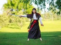 Young asian woman in traditional kimono trains fighting techniques with katana sword samurai warrior girl Royalty Free Stock Photo