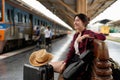 young asian woman traveler backpack waiting railway at train station, Summer holiday and travel concept Royalty Free Stock Photo