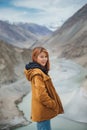 Young asian woman traveler enjoy traveling at confluence of zanskar and indus rivers in leh. Royalty Free Stock Photo