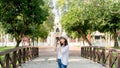 Young Asian woman traveler taking pictures on bidge , Temple background