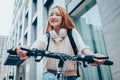 Young Asian woman using bicycle as a means of transportation