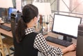 Young asian woman using desktop computer in the library Royalty Free Stock Photo