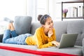 Young asian woman using laptop at house. Work at home Royalty Free Stock Photo