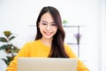 Young asian woman using laptop at house. Work at home Royalty Free Stock Photo